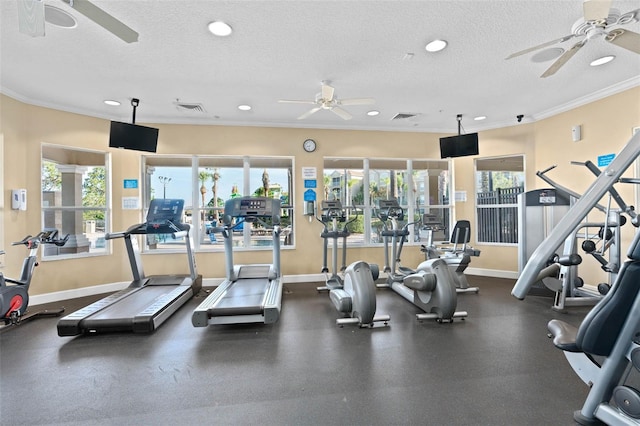 gym featuring a textured ceiling and crown molding