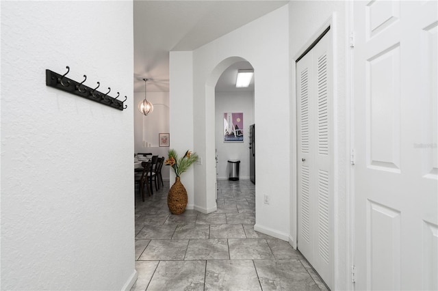 corridor featuring light tile patterned floors