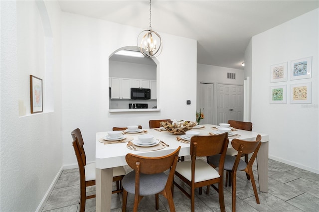 dining room with a notable chandelier