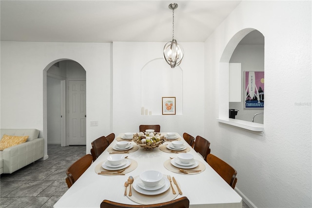 dining room with a notable chandelier