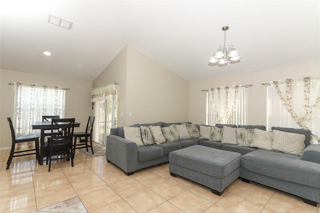 tiled living room with a chandelier and lofted ceiling