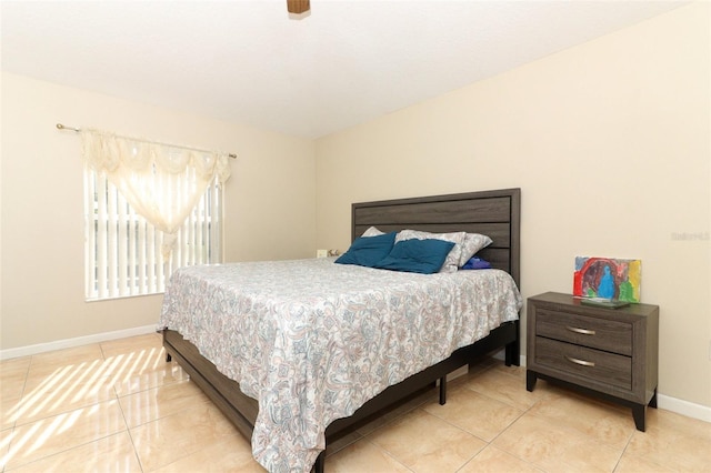 bedroom featuring light tile patterned floors and ceiling fan