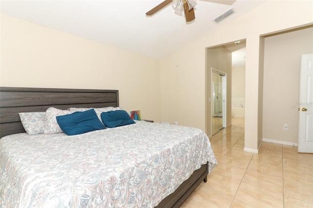 bedroom featuring ensuite bath, ceiling fan, light tile patterned floors, and lofted ceiling