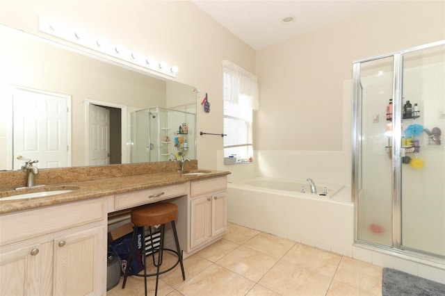 bathroom featuring tile patterned flooring, vanity, and plus walk in shower