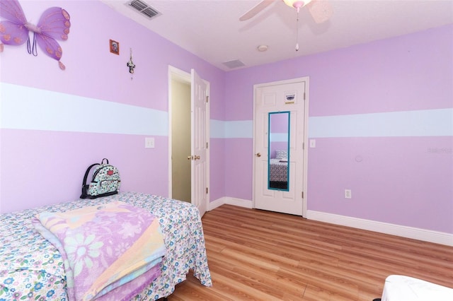 bedroom featuring ceiling fan and light hardwood / wood-style floors