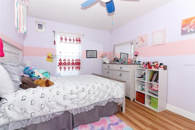 bedroom featuring ceiling fan and light wood-type flooring