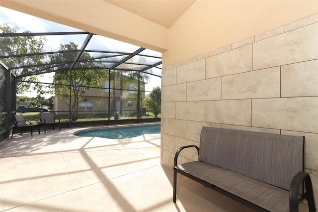 view of pool with a lanai and a patio area