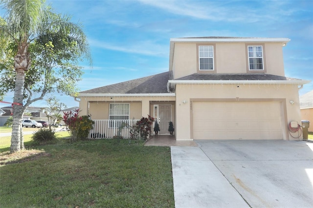 front of property featuring a porch, a front yard, and a garage