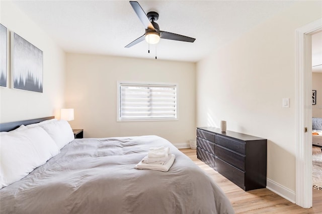 bedroom featuring ceiling fan and light hardwood / wood-style flooring