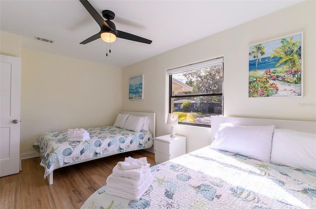 bedroom featuring ceiling fan and wood-type flooring