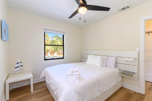 bedroom featuring light wood-type flooring and ceiling fan