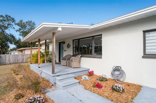 property entrance featuring covered porch