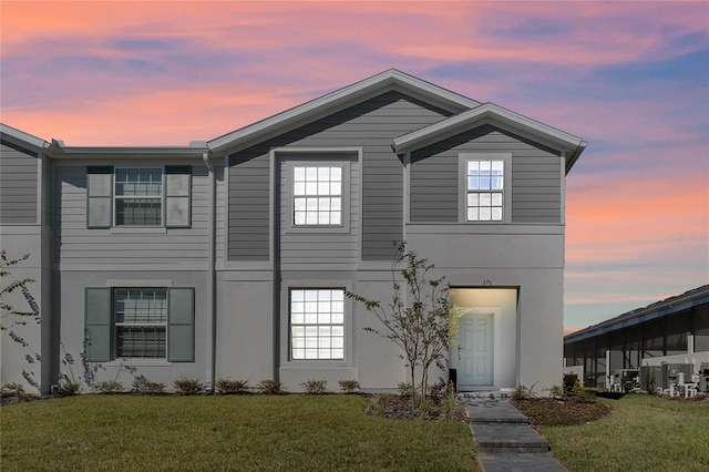 view of front of property with a yard