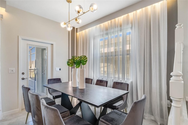 dining space featuring a chandelier