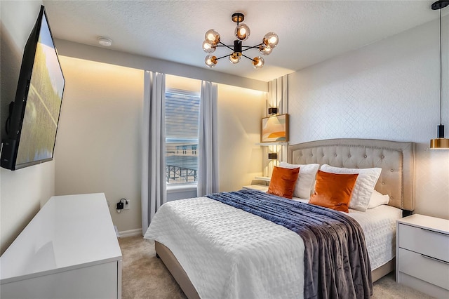 carpeted bedroom featuring a notable chandelier