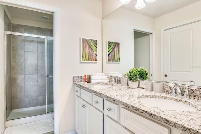 bathroom with vanity and an enclosed shower