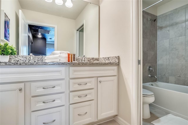 full bathroom featuring vanity, toilet, and tiled shower / bath