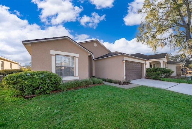 view of front of property featuring a garage and a front lawn