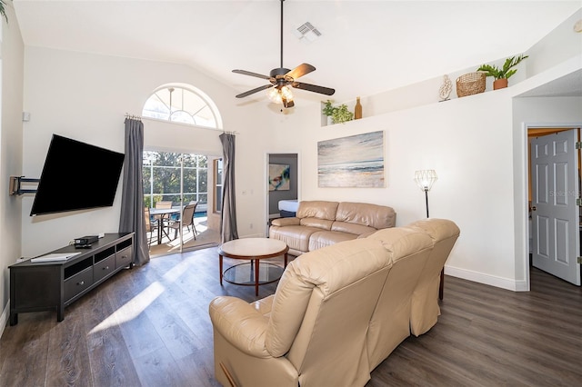 living room with lofted ceiling, ceiling fan, and dark wood-type flooring