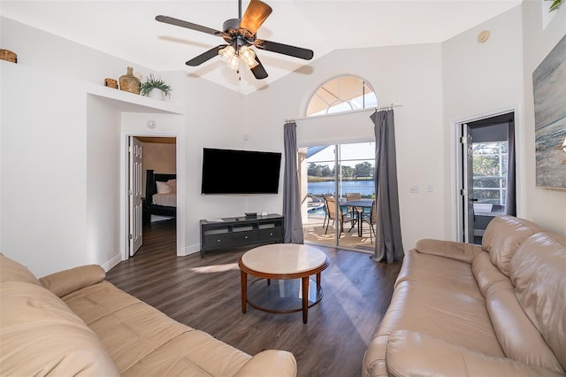 living room featuring ceiling fan, dark hardwood / wood-style floors, and a wealth of natural light