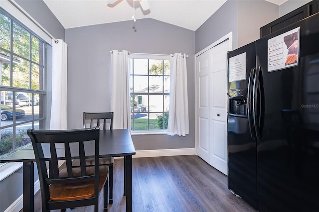 dining area featuring ceiling fan, plenty of natural light, dark wood-type flooring, and lofted ceiling