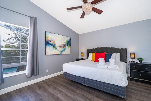 bedroom with vaulted ceiling, ceiling fan, and dark wood-type flooring