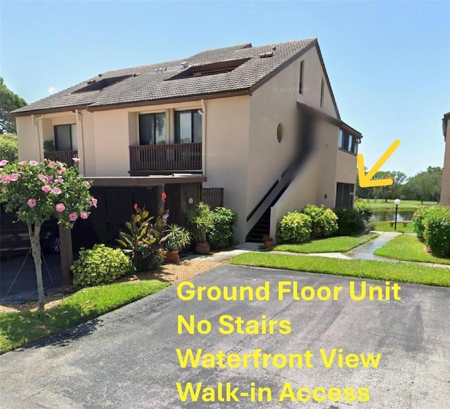 view of property featuring stairs