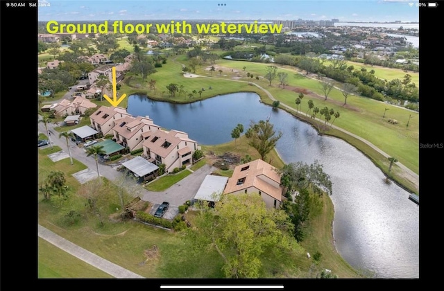 birds eye view of property featuring a water view and a residential view