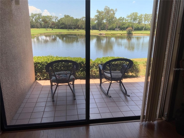 balcony featuring a water view