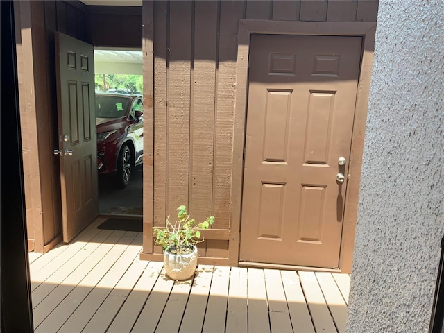 property entrance with board and batten siding