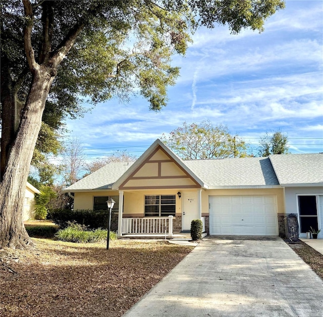 ranch-style house featuring a porch and a garage