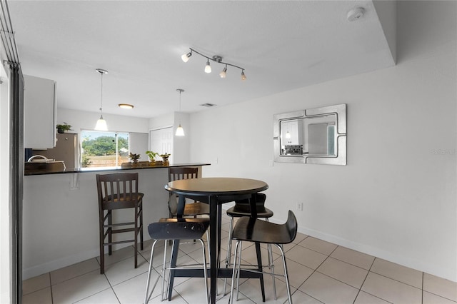 view of tiled dining space