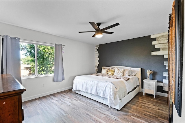 bedroom featuring ceiling fan and wood-type flooring