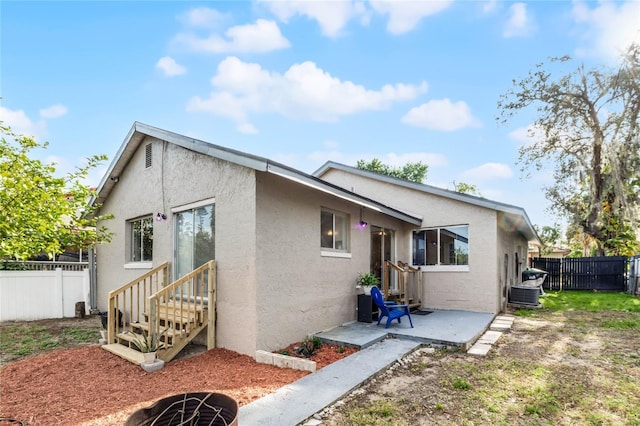 back of property featuring a patio area