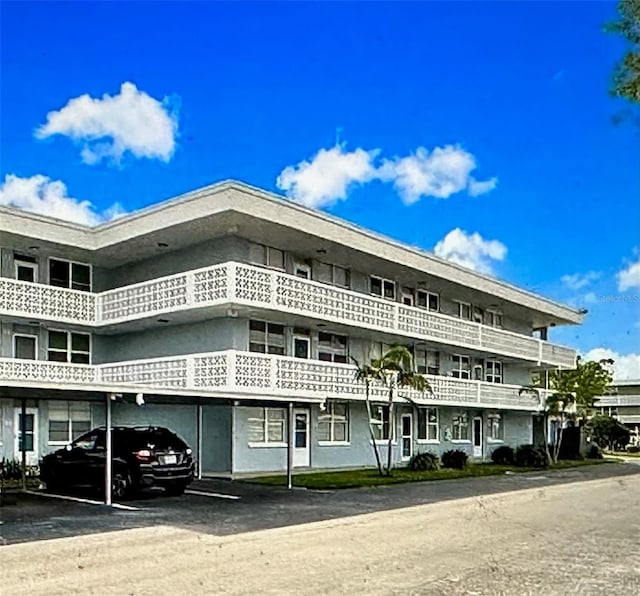 view of building exterior with a carport