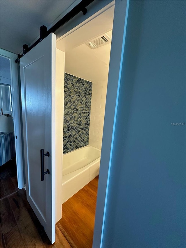 bathroom with hardwood / wood-style flooring