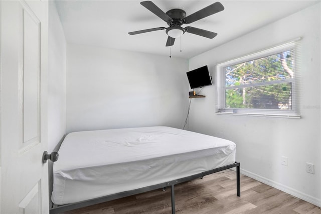 bedroom featuring light hardwood / wood-style floors and ceiling fan