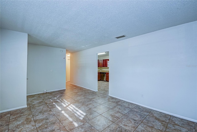 empty room with a textured ceiling