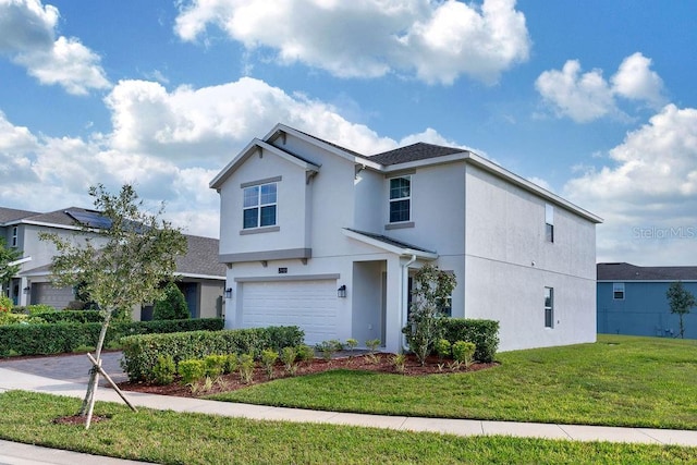 front of property with a front lawn and a garage