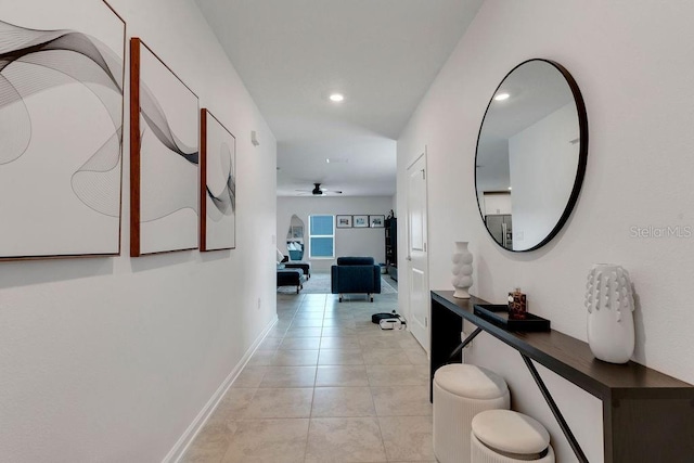 corridor with light tile patterned floors