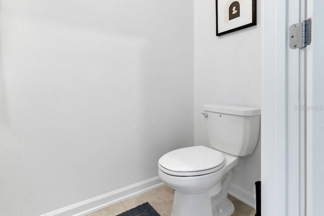 bathroom with tile patterned floors and toilet