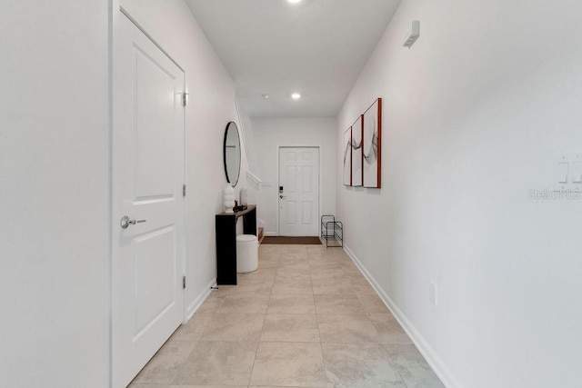 hallway with light tile patterned flooring