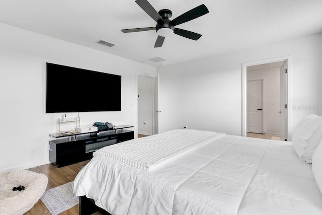 bedroom featuring ceiling fan and light hardwood / wood-style flooring