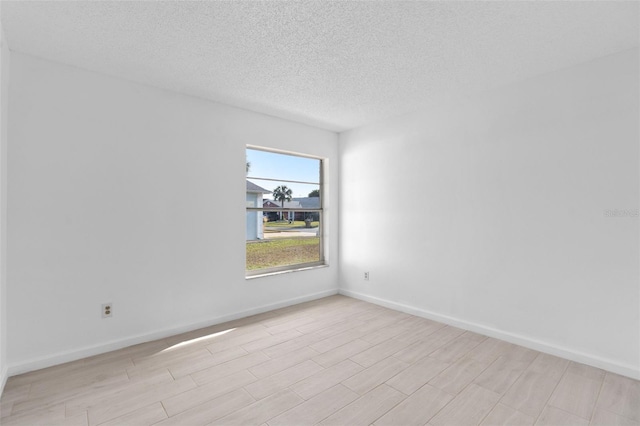 spare room featuring a textured ceiling