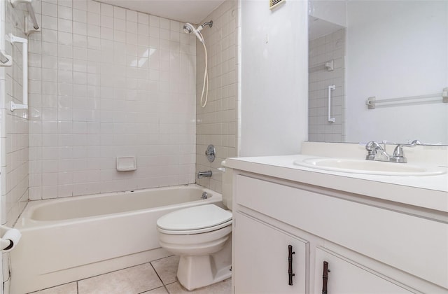 full bathroom with tile patterned floors, vanity, toilet, and tiled shower / bath
