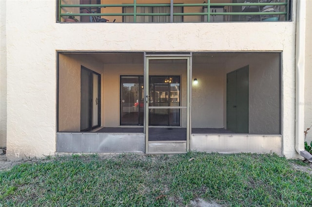 entrance to property featuring a balcony