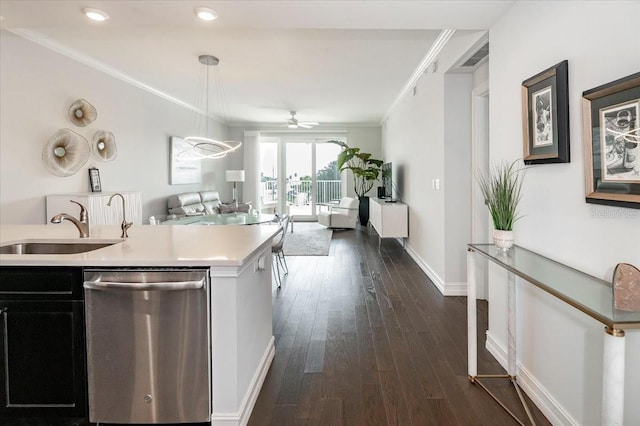 kitchen with ornamental molding, pendant lighting, stainless steel dishwasher, and dark hardwood / wood-style flooring