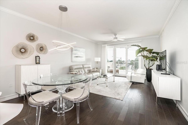 dining room with ceiling fan, dark hardwood / wood-style flooring, and ornamental molding