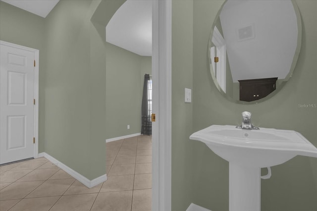 bathroom with tile patterned floors