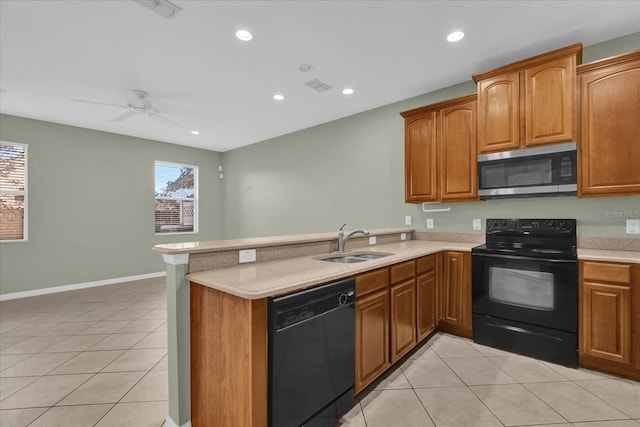 kitchen with kitchen peninsula, ceiling fan, sink, black appliances, and light tile patterned flooring